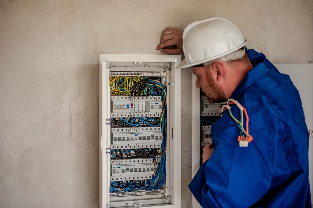 Electrician converting an electrical unit